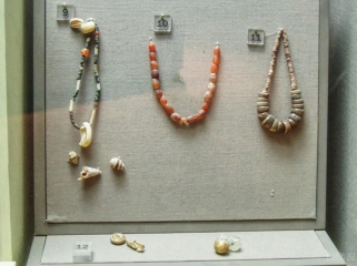 Beads: carnelian, softstone, coloured stone, shell, gold, polished quartz; cowrie shell pendant - Jebel Al Buhais, 2000 BC